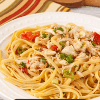 Linguine tossed wtih lump crabmeat, scallions, and plum tomatoes in garlicky white wine butter sauce.