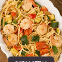 Linguine with sautéed zucchini, red bell pepper, and shrimp, tossed in a light garlic sauce.