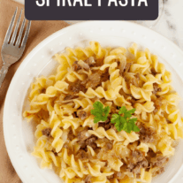 Spiral pasta tossed with caramelized onions and crumbled sausage.