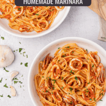 Linguine with calamari; two bowls of linguine tossed in homemade marinara with rings of squid and tentacles.