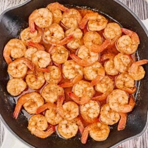 Savory shrimp recipes; A pan full of shrimp sautéed in butter seasoned with Old Bay Seasoning blend.