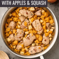Pork medallions with butternut squash and apples simmered in a maple-thyme sauce with bacon, served in a stainless-steel skillet.