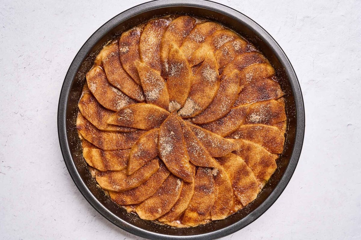 Golden Delicious apple cake dusted with cinnamon sugar and ready for the oven.