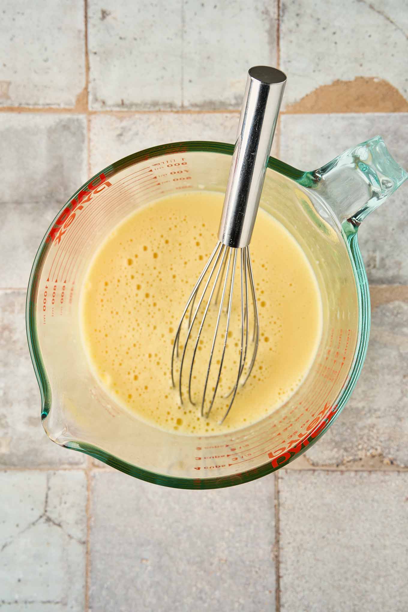 Whisked egg whites combined with egg yolks, tempered and ready to be added to egg and lemon soup.