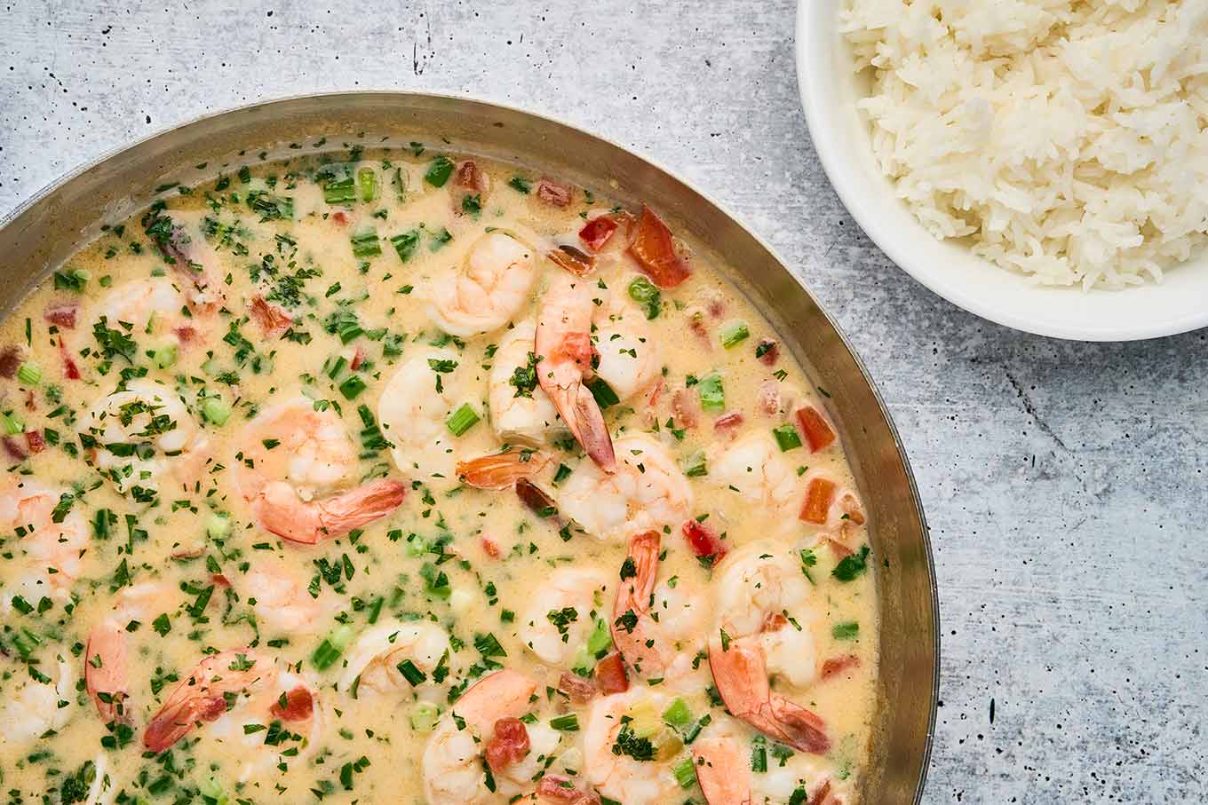 Shrimp simmered in coconut broth with scallions and cilantro for Brazilian coconut shrimp stew.