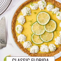 Classic Florida Key Lime pie garnished with whipped cream, lime slices, and lime zest.