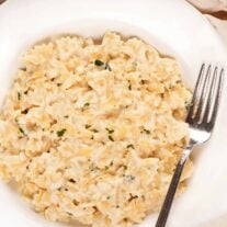A single serving of cottage cheese mac and cheese with fontina in a white bowl.