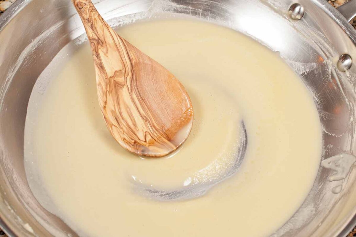 Smooth blond roux cooked for béchamel sauce in homemade macaroni and cheese.