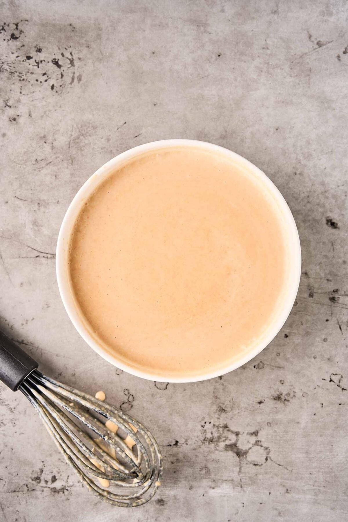 Thai peanut curry sauce made with coconut milk, peanut butter, and red curry paste whisked until smooth.