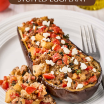 Roasted Mediterranean stuffed eggplant with lamb, goat cheese, tomatoes, mint, and pine nuts.