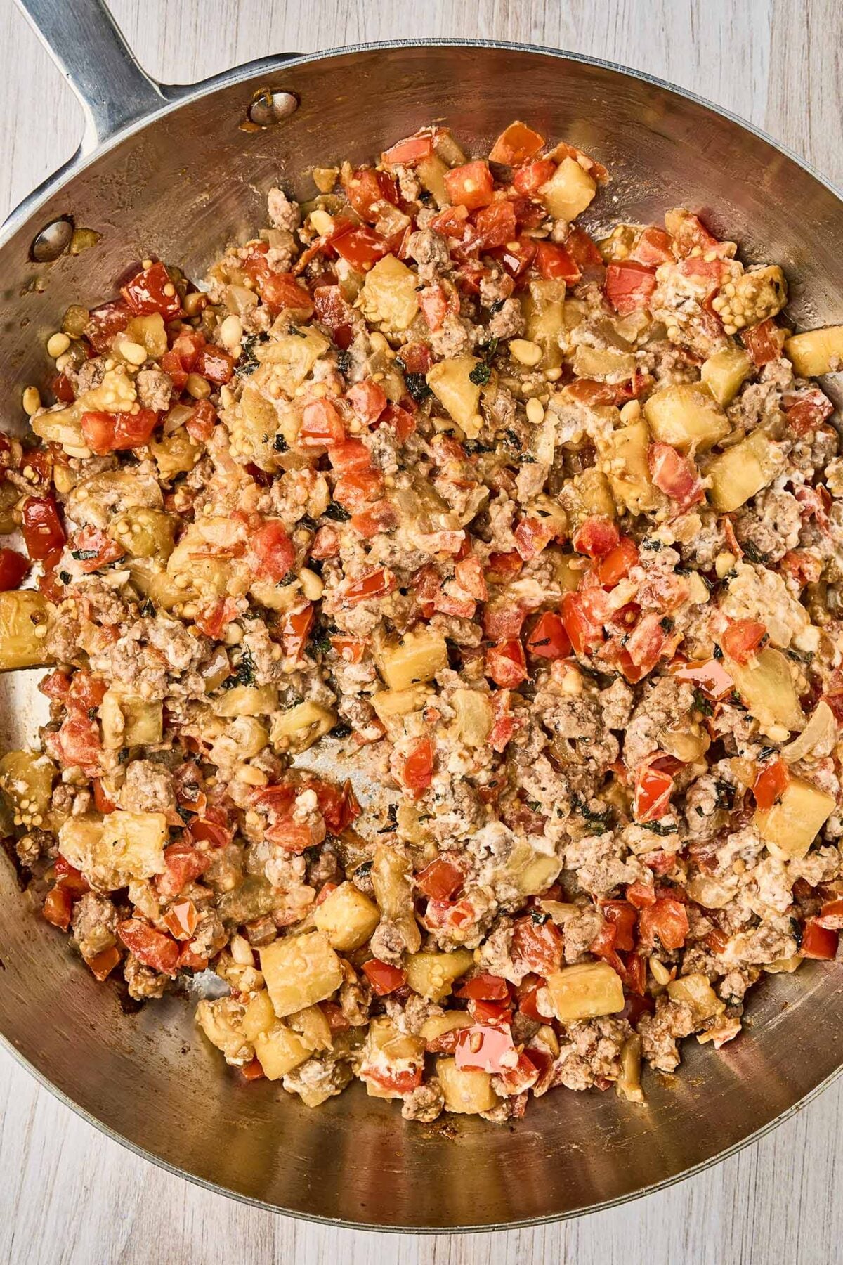 Lamb, eggplant, tomatoes, goat cheese, and pine nuts combined for Mediterranean stuffed eggplant with lamb.