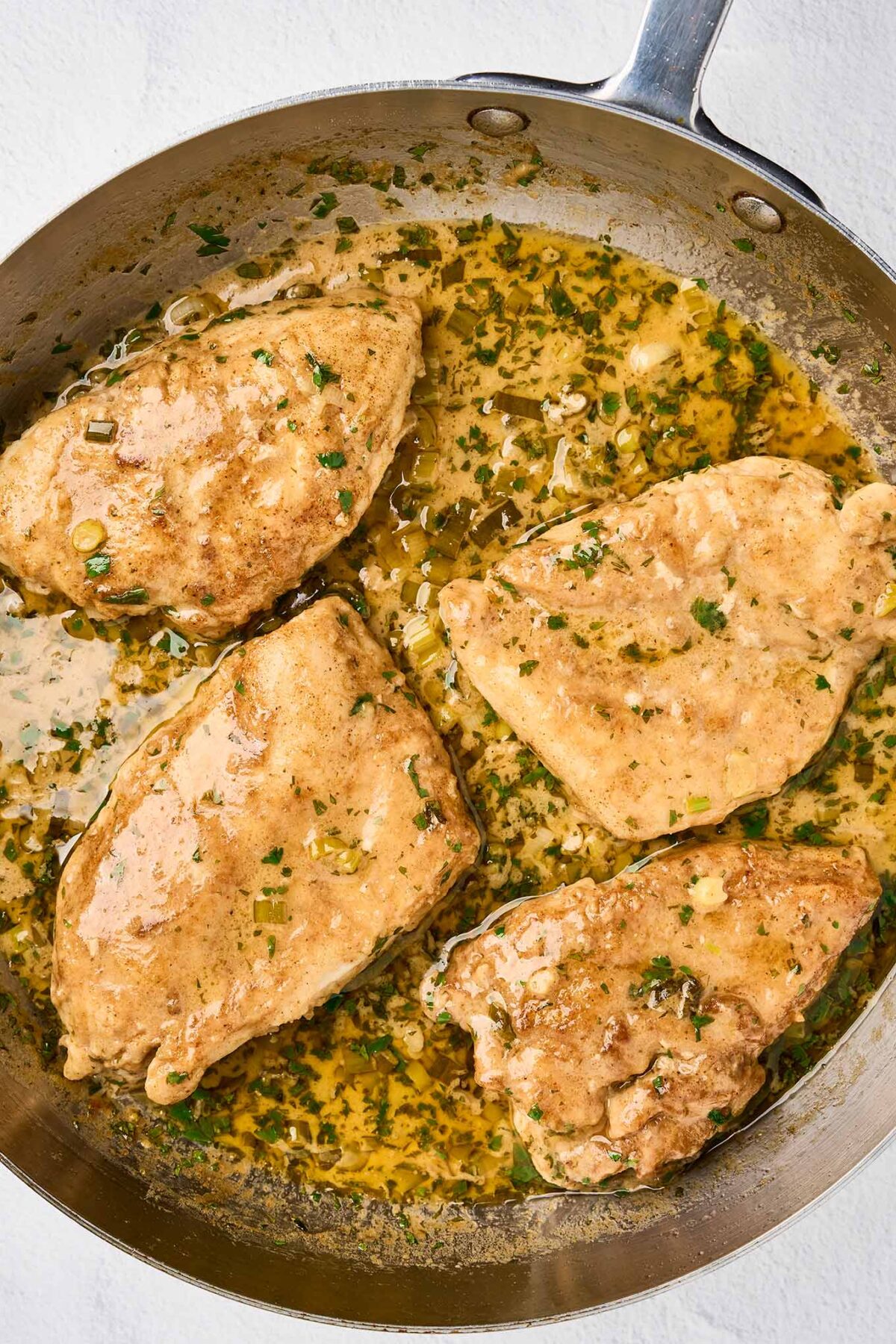 Chicken returned to the cilantro lime cream sauce to warm before serving.