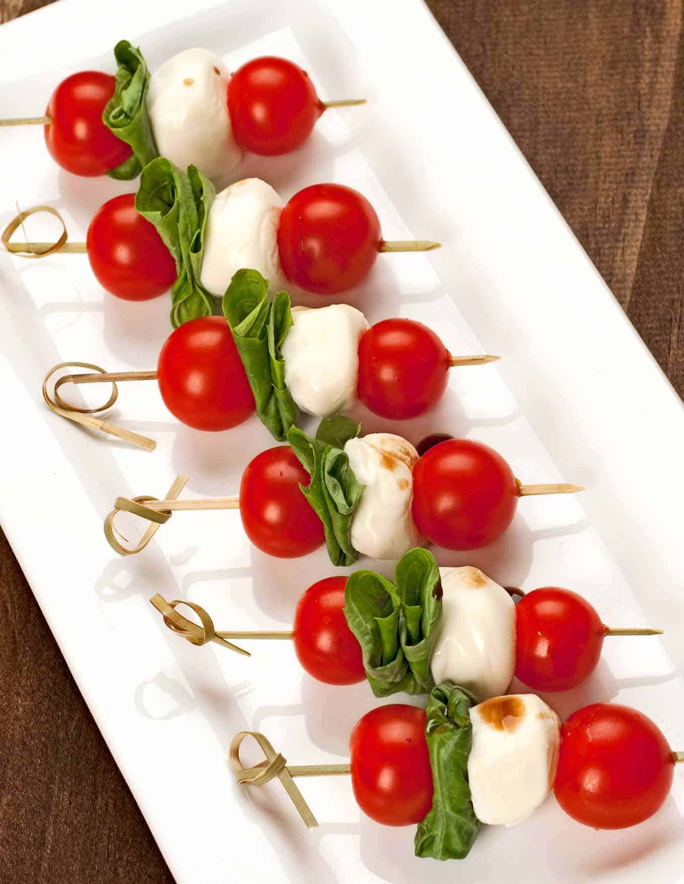 Caprese salad skewers on serving plate
