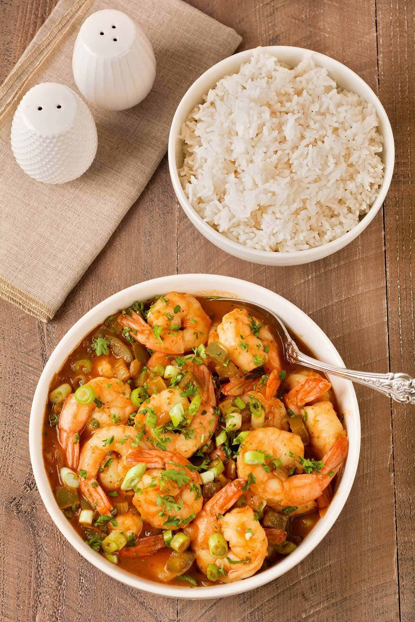 Serving bowls of Louisiana-style shrimp and steamed white rice