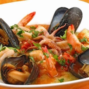 Seafood Medley with Tomato-Butter Sauce and Soft Polenta