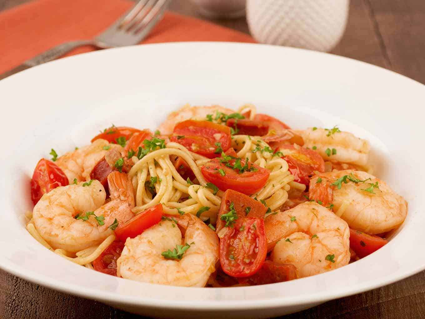 Bowl of spaghetti tossed with sautéed shrimp and diced Spanish chorizo.