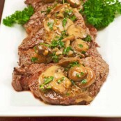 Medallions of filet mignon topped with sautéed mushrooms and a brandy cream sauce.
