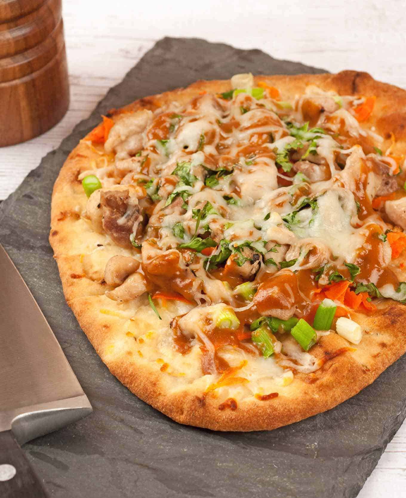 Thai chicken flatbread on serving tray